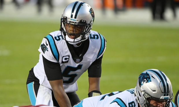 LANDOVER, MARYLAND - DECEMBER 27: Teddy Bridgewater #5 of the Carolina Panthers looks on under cent...