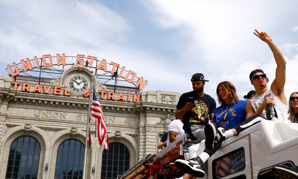 Michael Porter Jr. #1 of the Denver Nuggets waves to fans during the Denver Nuggets victory parade ...