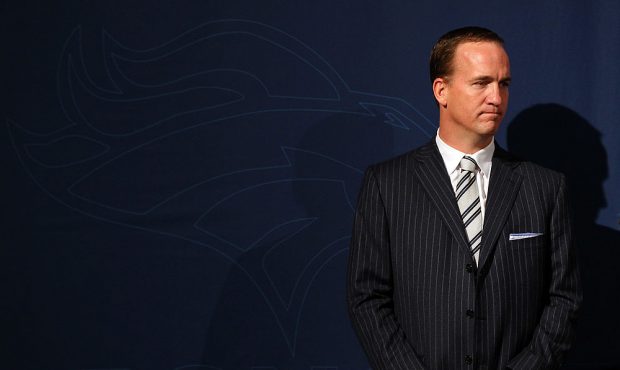 ENGLEWOOD, CO - MARCH 20: Quarterback Peyton Manning looks over at the podium during the news confe...