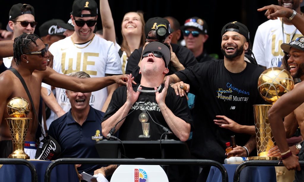 Head coach Michael Malone speaks during the Denver Nuggets victory parade and rally after winning t...