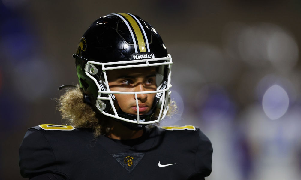 Julian "Ju Ju" Lewis #10 of the Carrollton High School Trojans walks off the field against the West...