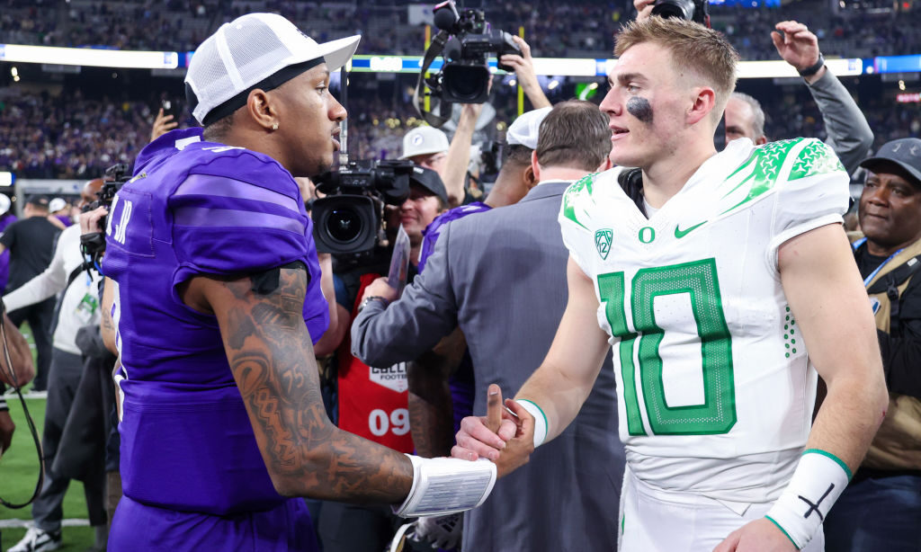 Michael Penix Jr. #9 of the Washington Huskies and Bo Nix #10 of the Oregon Ducks...