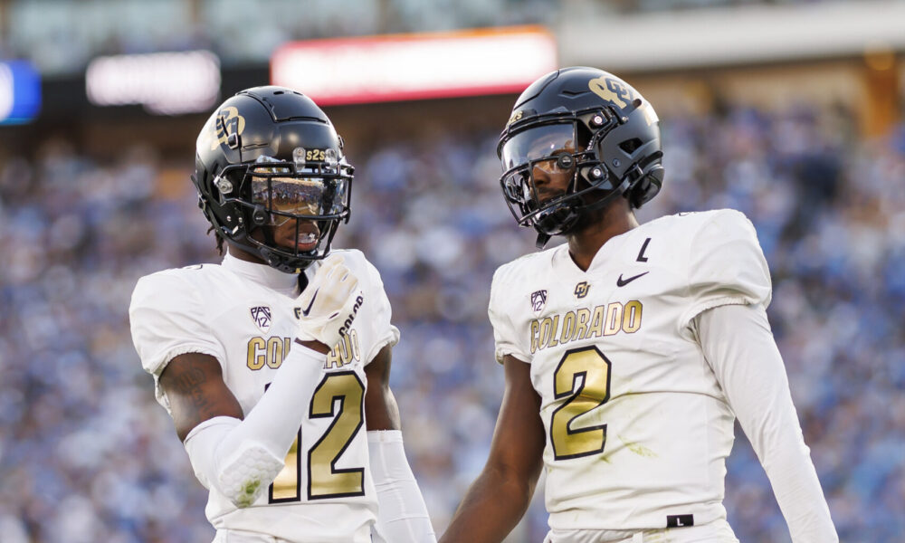 Travis Hunter #12 and Shedeur Sanders #2 of the Colorado Buffaloes...