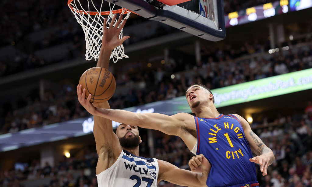 Michael Porter Jr. #1 of the Denver Nuggets goes to the basket against Rudy Gobert #27 of the Minne...