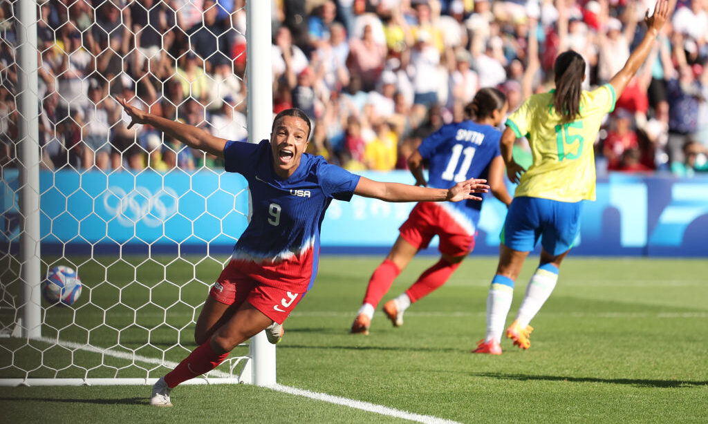 Mallory Swanson #9 of Team United States celebrates scoring her team's first goal during the Women'...