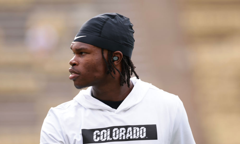 BOULDER, COLORADO - AUGUST 29: Travis Hunter #12 of the Colorado Buffaloes warms up prior to the ga...