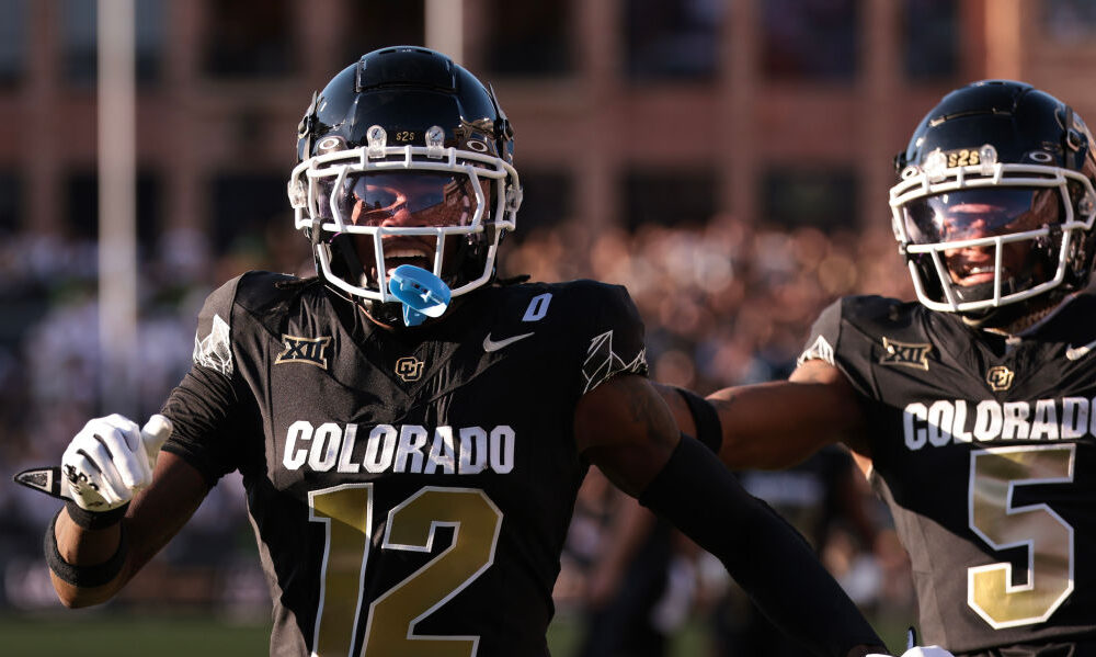 Travis Hunter #12 of the Colorado Buffaloes celebrates scoring a touchdown during the first quarter...