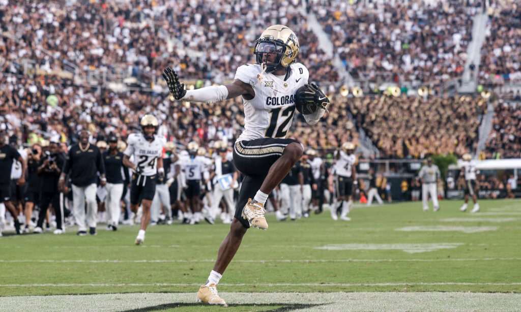 Travis Hunter #12 of the Colorado Buffaloes hits the Heisman Pose after making an interception duri...