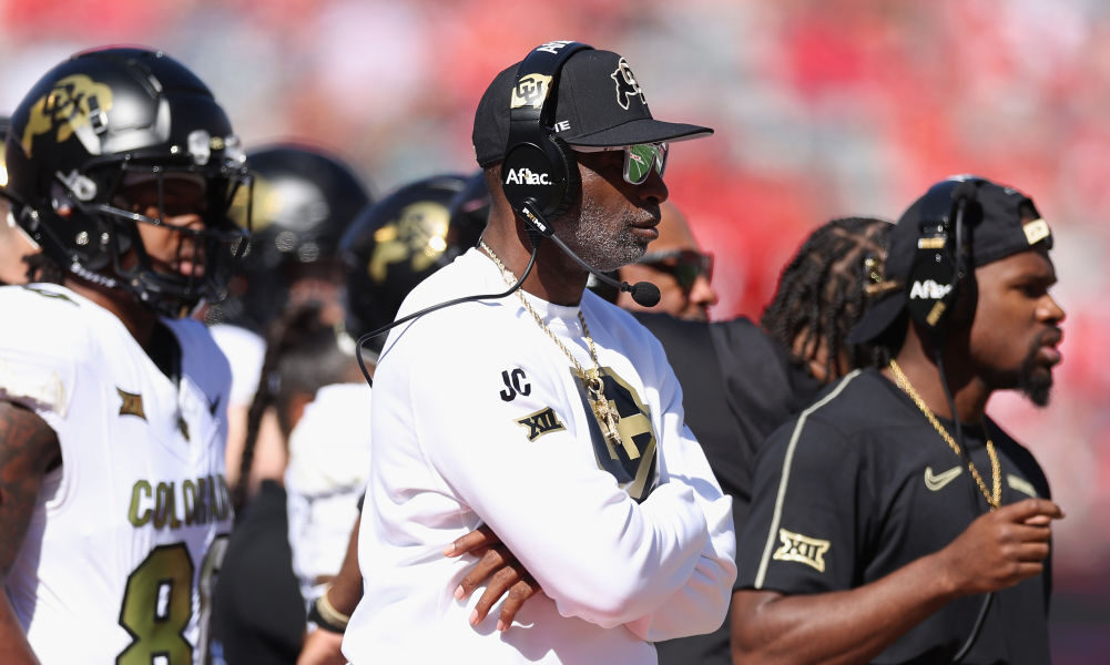 Head coach Deion Sanders of the Colorado Buffaloes watches from the sidelines during the first half...