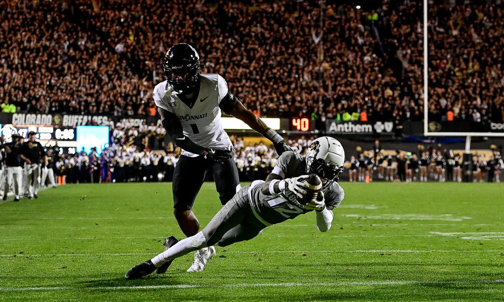 Travis Hunter #12 of the Colorado Buffaloes scores a second quarter touchdown against the Cincinnat...