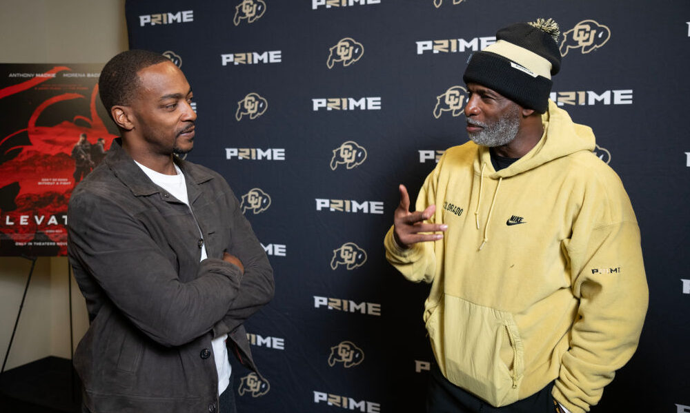 BOULDER, COLORADO - NOVEMBER 04: Anthony Mackie and Deion Sanders talk before a Elevation Special S...