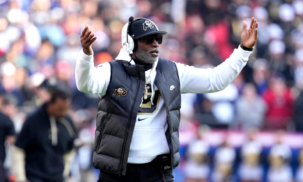 Head coach Deion "Coach Prime" Sanders of the Colorado Buffaloes gestures during a game against the...