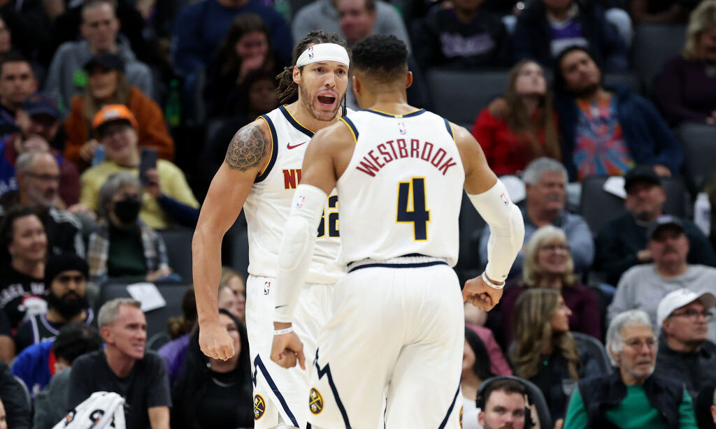 Aaron Gordon #32 celebrates with Russell Westbrook #4 of the Denver Nuggets...