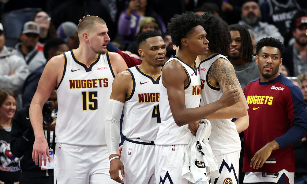 SACRAMENTO, CALIFORNIA - DECEMBER 16: The Denver Nuggets congratulate one another after they beat t...