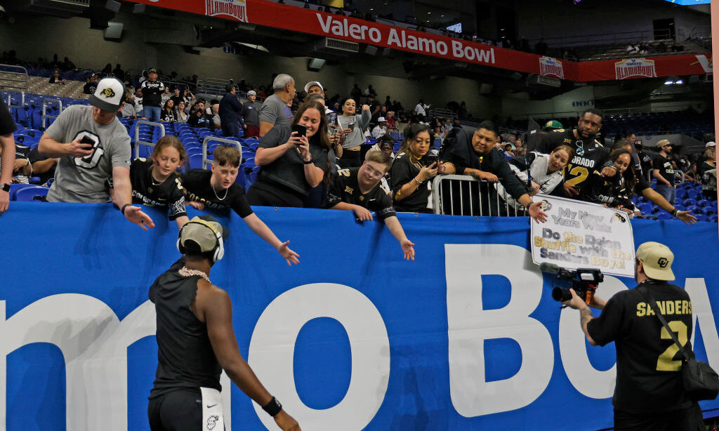 Shedder Sanders #2 of the Colorado Buffaloes greets fans before the game against the BYU Cougars in...