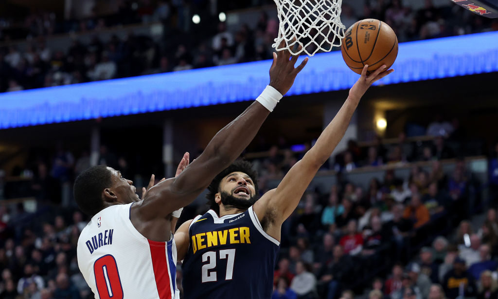 Jamal Murray #27 of the Denver Nuggets goes to the basket against Jalen Duren #0 of the Detroit Pis...