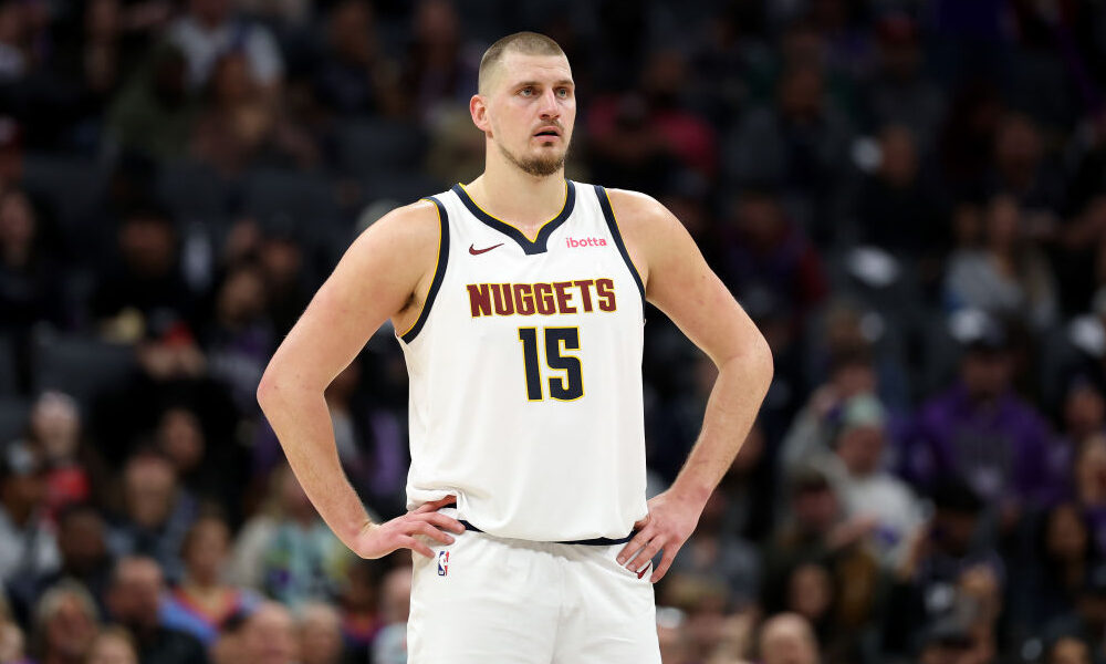 SACRAMENTO, CALIFORNIA - DECEMBER 16: Nikola Jokic #15 of the Denver Nuggets stands on the court du...