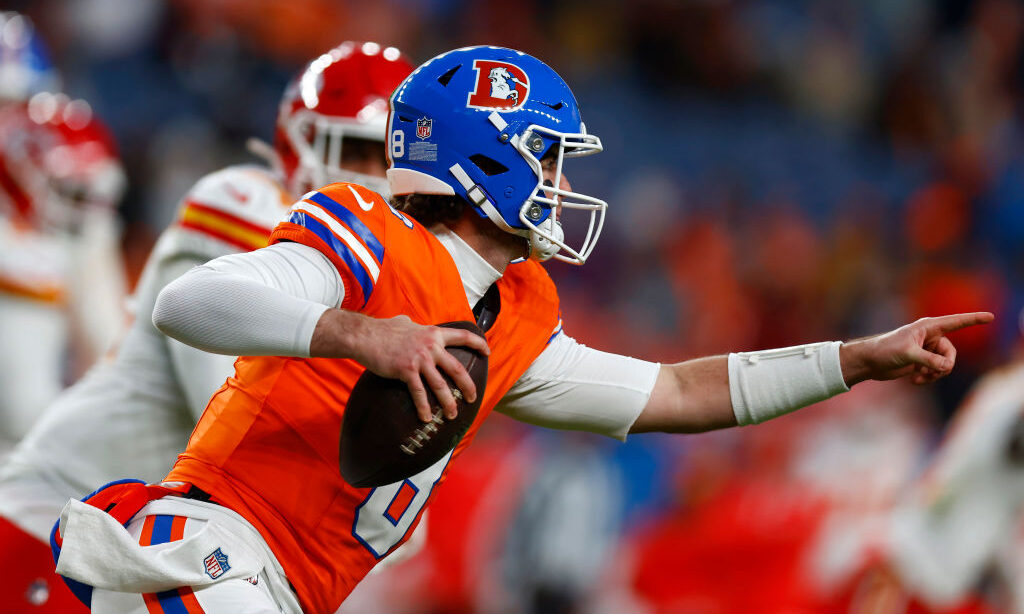 Jarrett Stidham #8 of the Denver Broncos runs with the ball in the fourth quarter against the Kansa...