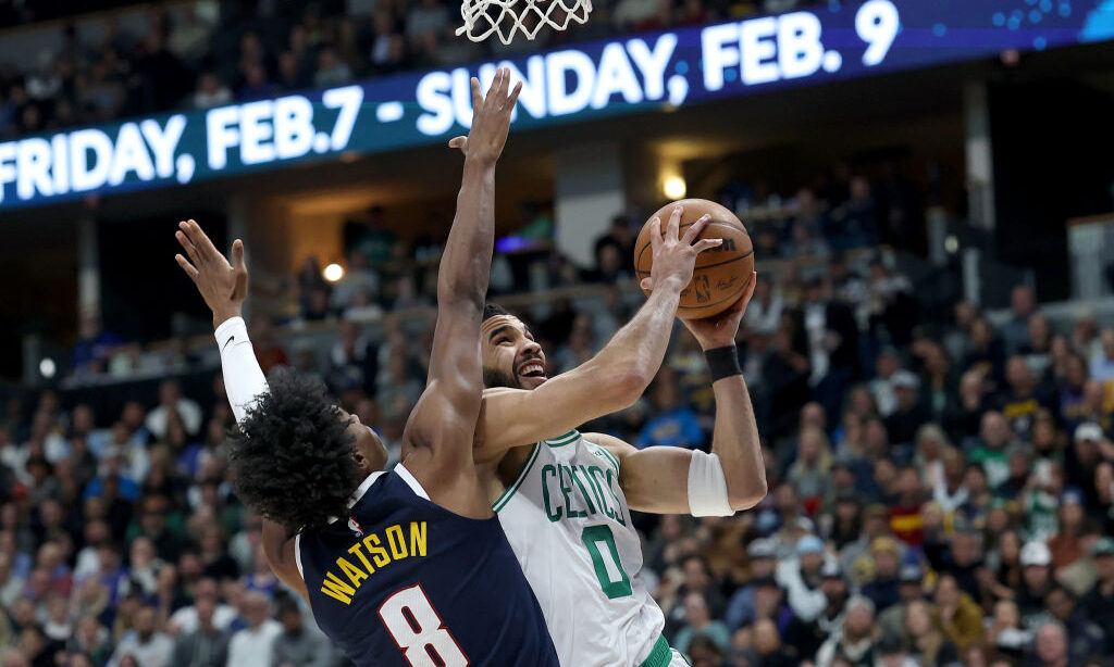 DENVER, COLORADO - JANUARY 07: Jayson Tatum #0 of the Boston Celtics drives to the basket against P...