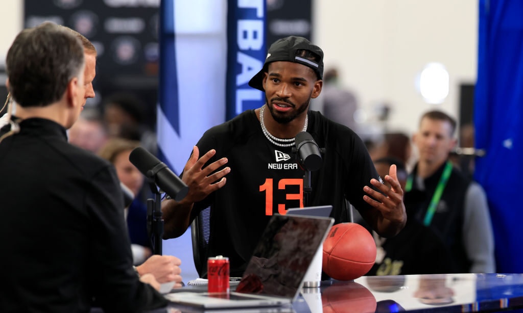 Shedeur Sanders #QB13 of Colorado speaks to the media during the 2025 NFL Scouting Combine at Lucas...