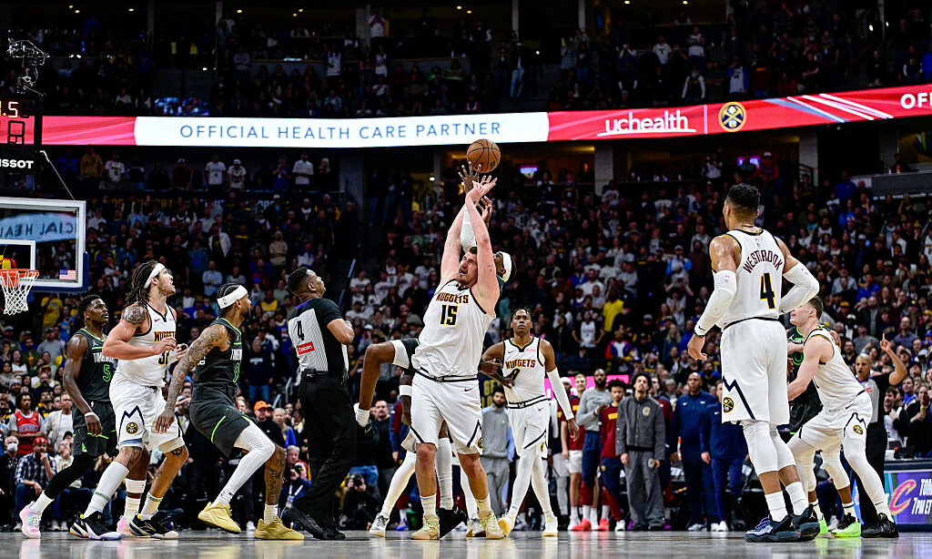 DENVER, COLORADO - APRIL 1: Nikola Jokic #15 of the Denver Nuggets competes for the tip off against...
