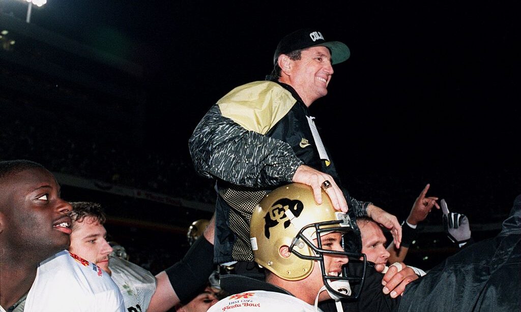 COLORADO HEAD COACH BILL MCCARTNEY IS CARRIED OFF THE FIELD AFTER HIS TEAM DEFEATED NOTRE DAME 41-2...