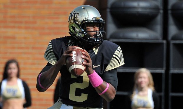 WINSTON-SALEM, NC - OCTOBER 24: Kendall Hinton #2 of the Wake Forest Demon Deacons drops back to pa...