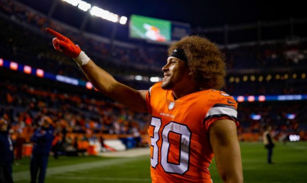 DENVER, CO - NOVEMBER 25: Running back Phillip Lindsay #30 of the Denver Broncos walks off the fie...