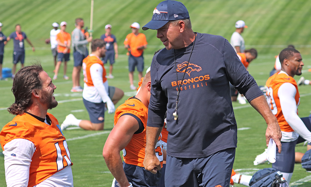 Broncos coach Sean Payton and linebacker Alex Singleton preseason...